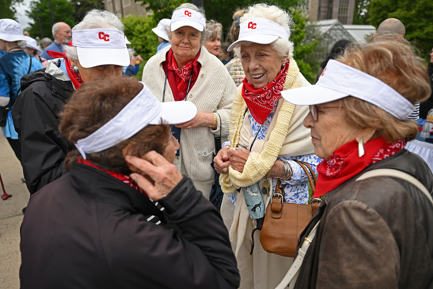 A group of alumni meet before the class parade