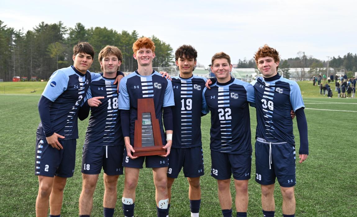 Freshmen of the Men's Soccer Team Pose with Trophy.