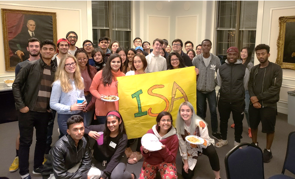 Students pose as a group after the Fall Weekend parentless dinner 