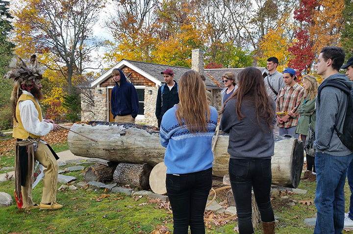 Students in Anthropology 114 (Power and Inequality in a Global World) learn about Mohegan lifeways and methods for making dug-out canoes.