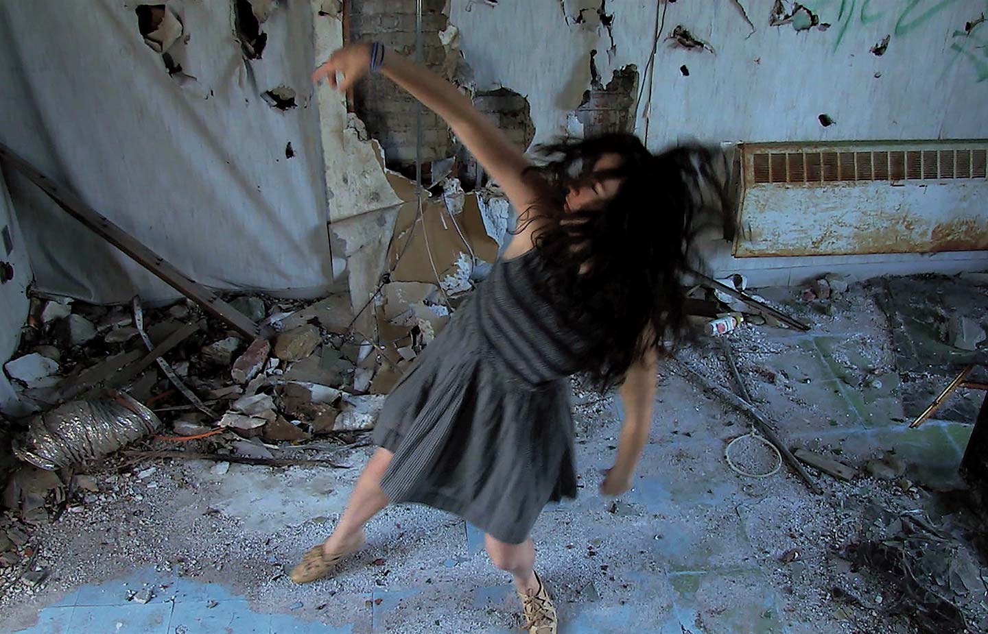 Still image of woman dancing from student film, Alice, by George Scarles ’15
