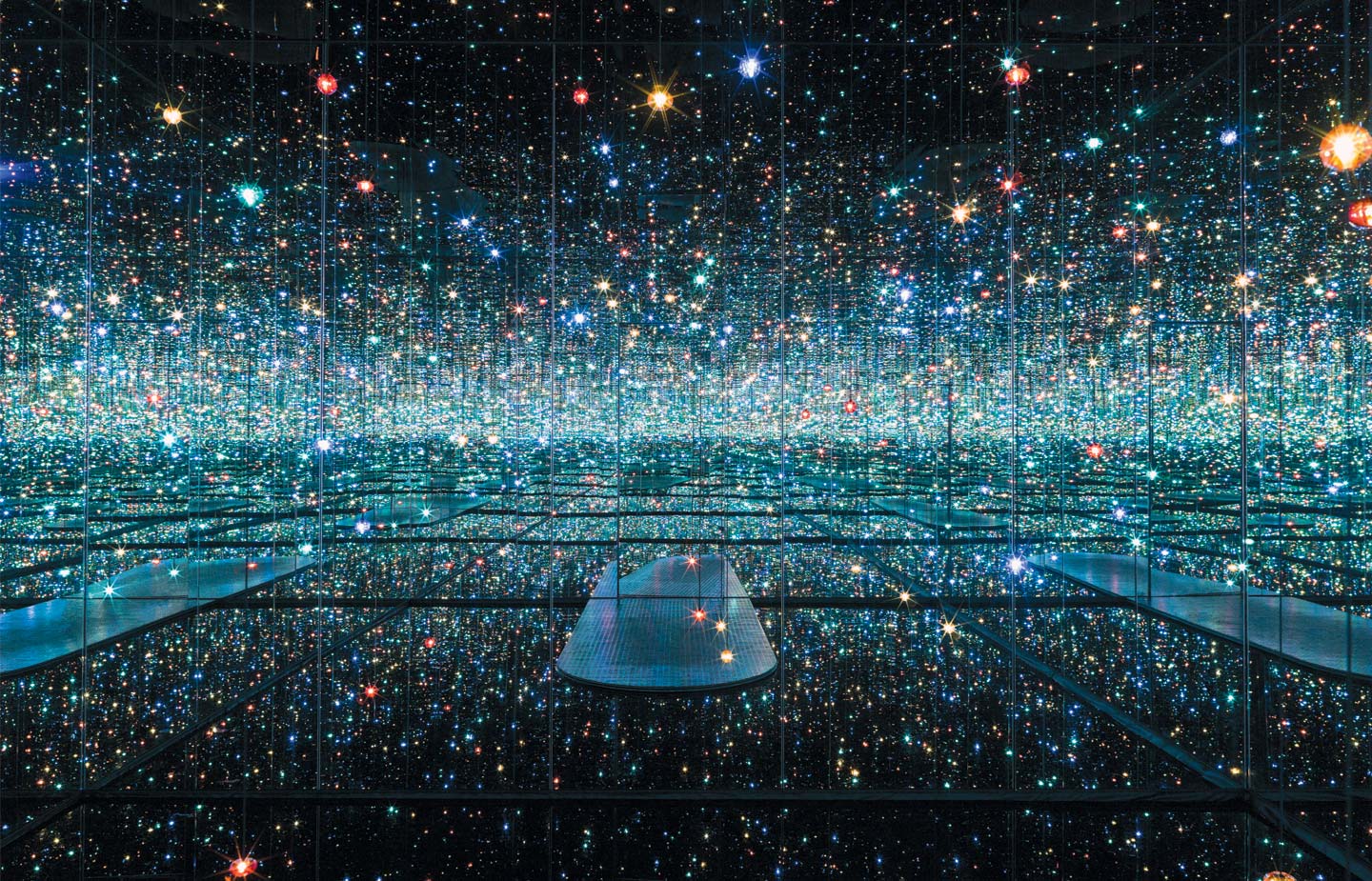 Infinity Mirrored Room – The Souls of Millions of Light Years Away, 2013. Wood, metal, glass mirrors, plastic, acrylic panel, rubber, LED lighting system, acrylic balls and water, 113 1/4 x 163 1/2 x 163 1/2 in.  Courtesy of David Zwirner, N.Y. © Yayoi Kusama