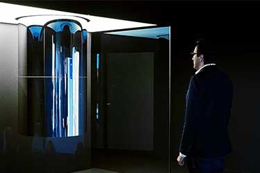 Man stands in front of IBM's quantum computer