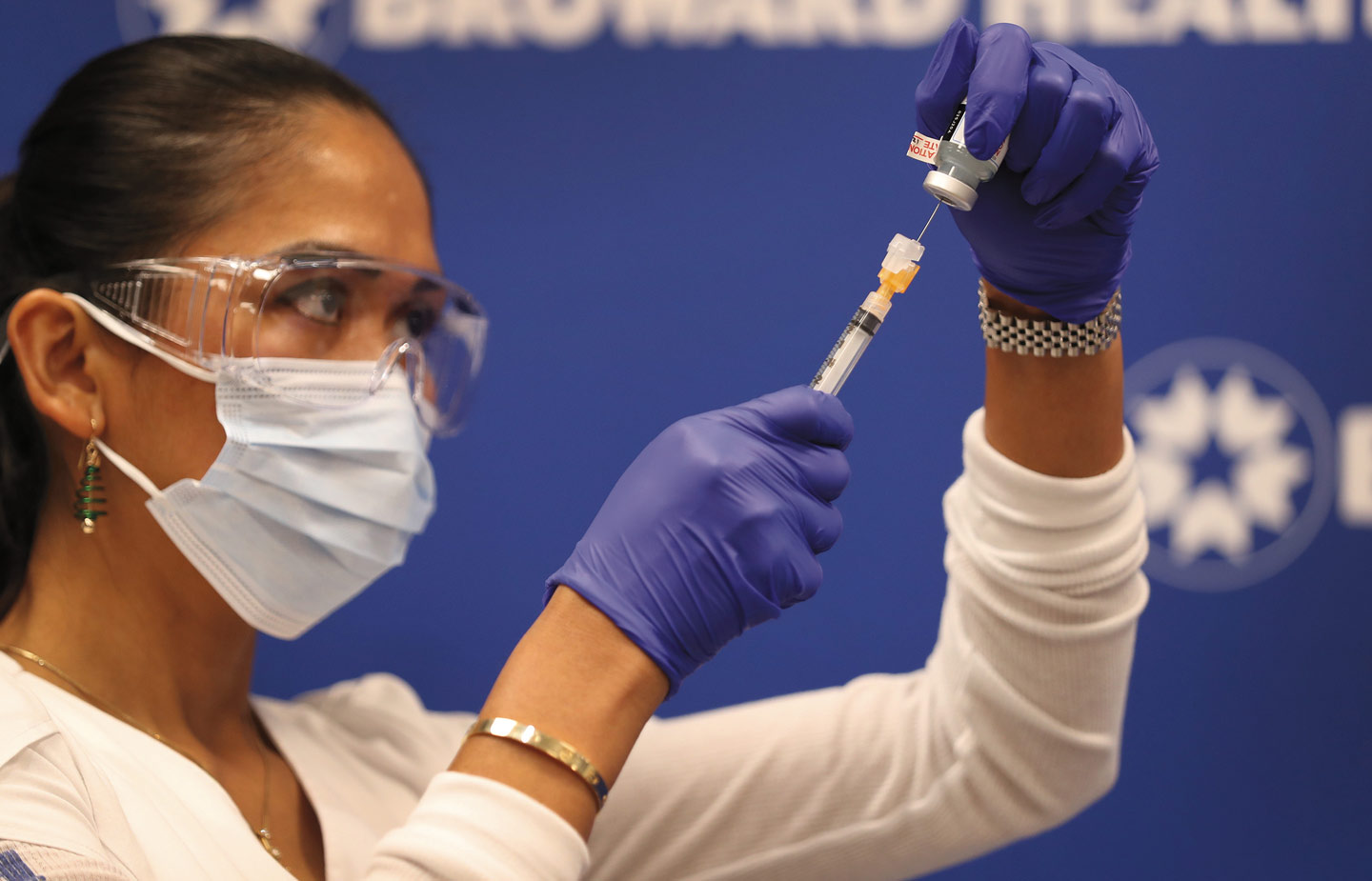 Nurse preparing shot of COVID-19 vaccine