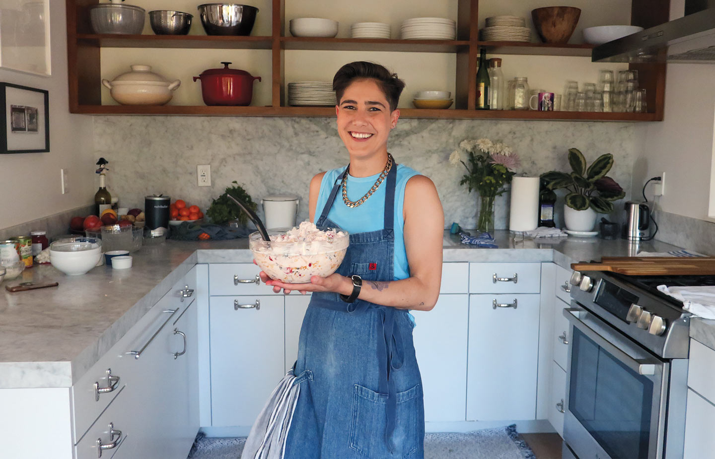 Image of Casey Corn ’10 holding ambrosia in a kitchen