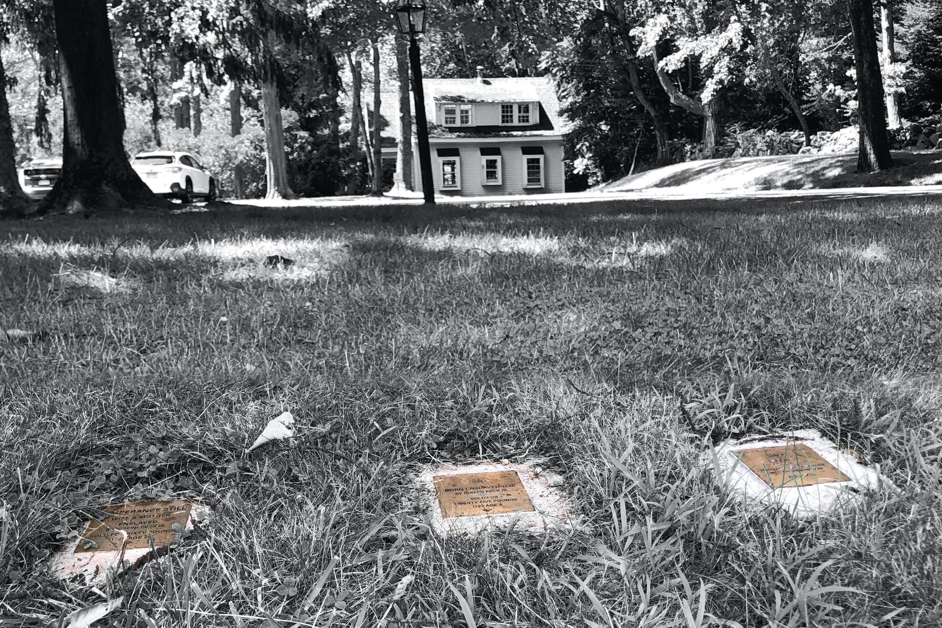 Witness stone markers in front of a house in Old Lyme, CT