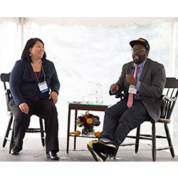 Andre Robert Lee '93, right, and Liza Talusan ’97 discuss Lee's newest film, “I’m Not Racist, Am I?” during Connecticut College's Fall Weekend celebration. 