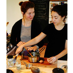 Emily MacGibeny '16 (left) and Azul Tellez '15 are putting their Davis Prize for Peace grant to good use by bringing healthy meals and cooking classes to an impoverished section of Portland, Ore.