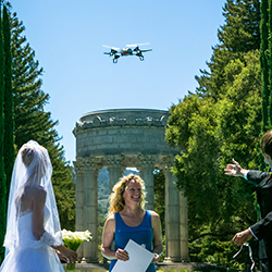 Ring bearer: A quadcopter drone delivers wedding bands to Otavio and Zina Good during their July 2013 wedding ceremony at Pulgas Water Temple in Redwood City, Calif. Image illustration based on photograph by Frances VonWong. 
