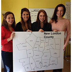 Four of the seven Connecticut College fellows working with the New London County Food Policy Council (from left to right): Eleanor Hardy '15, policy fellow; Julia Goldman '15, senior fellow for the council; Paige Ziplow '15, nutrition education fellow; and Wesley Conner '17, food hub feasibility fellow. 