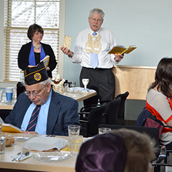 Rabbi Aaron Rosenberg leads the first Seder at Zachs Hillel House, which opened in January. Photo by Grace Griffin '14.