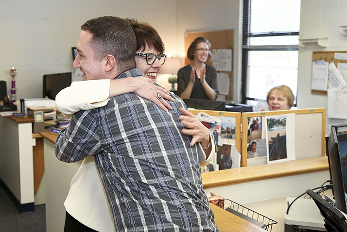 President Bergeron hugs Kyle Berg