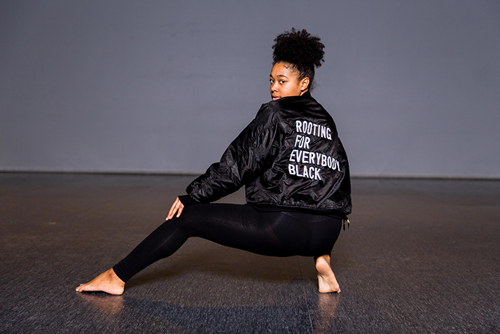 Tanaya Cadenales ’18 wears a statement jacket for her performance in “We Are Here,” a step piece by Jenaya Amore ’19.