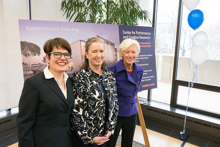 (From left) President Katherine Bergeron, Nancy Marshall Athey ’72 and Board of Trustee Chair Pamela D. Zilly ’75 pose in front of a rendering of the new center for performance and creative research at the campus celebration. 