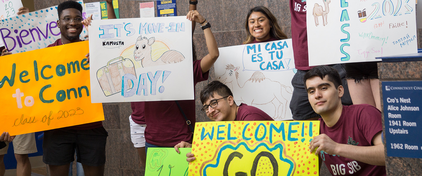Students welcome the newest camels with colorful signs.
