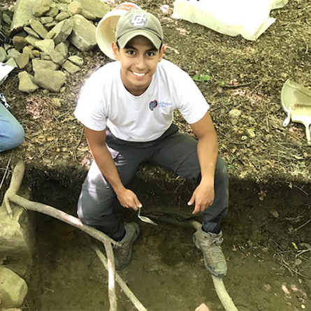 Hector Salazar conducts archaeological research at a dig site.