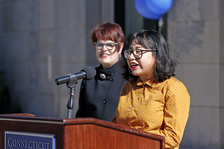 Kiara Rivera ’21 shares her experiences as a theater major with the crowd at the groundbreaking ceremony, as President Bergeron looks on. 