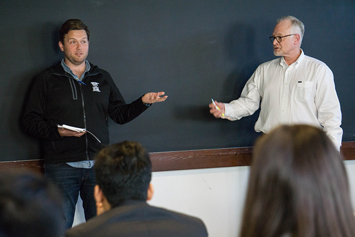 Adam Romanow ’07, founder and president of Castle Island Brewing Co., left, and Foltz speak during Fast Forward. 