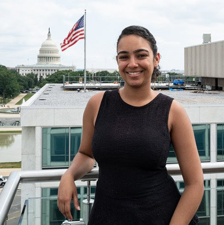A portrait of Laila Bera '23 with the U.S. Capitol in the background.