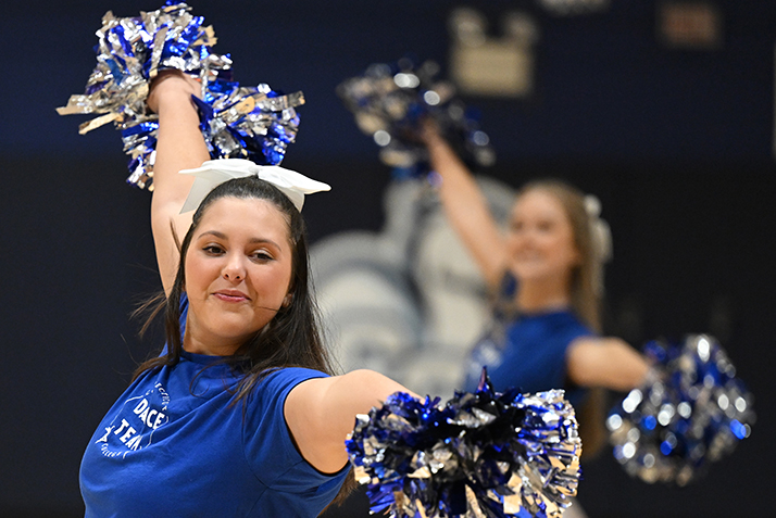 The dance team performs during a men's basketball game.