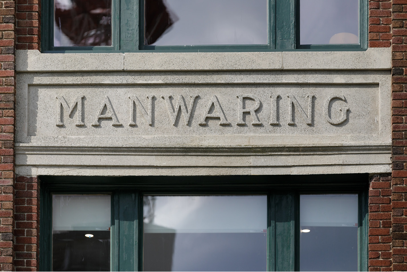 The Manwaring sign on the building