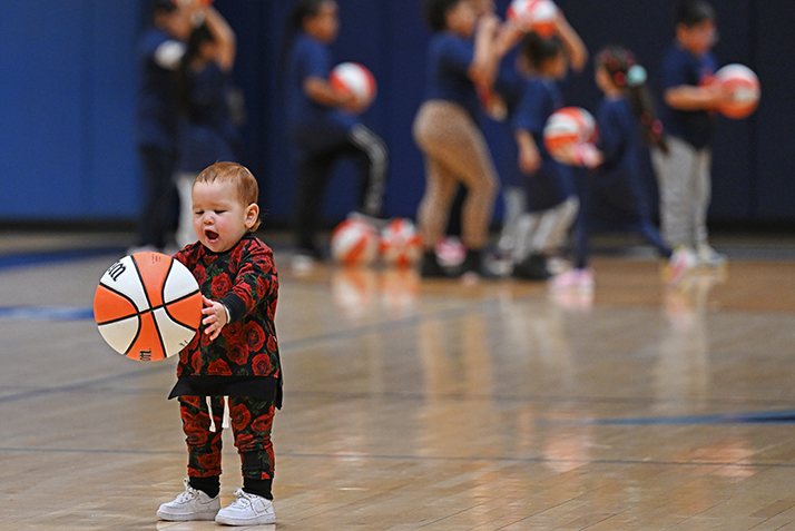 Phoebe Gonzalez-Cottrell, daughter of Captain Brandon Gonzalez-Cottrell, of the Salvation Army New London Corps, takes her turn working on ball handling.