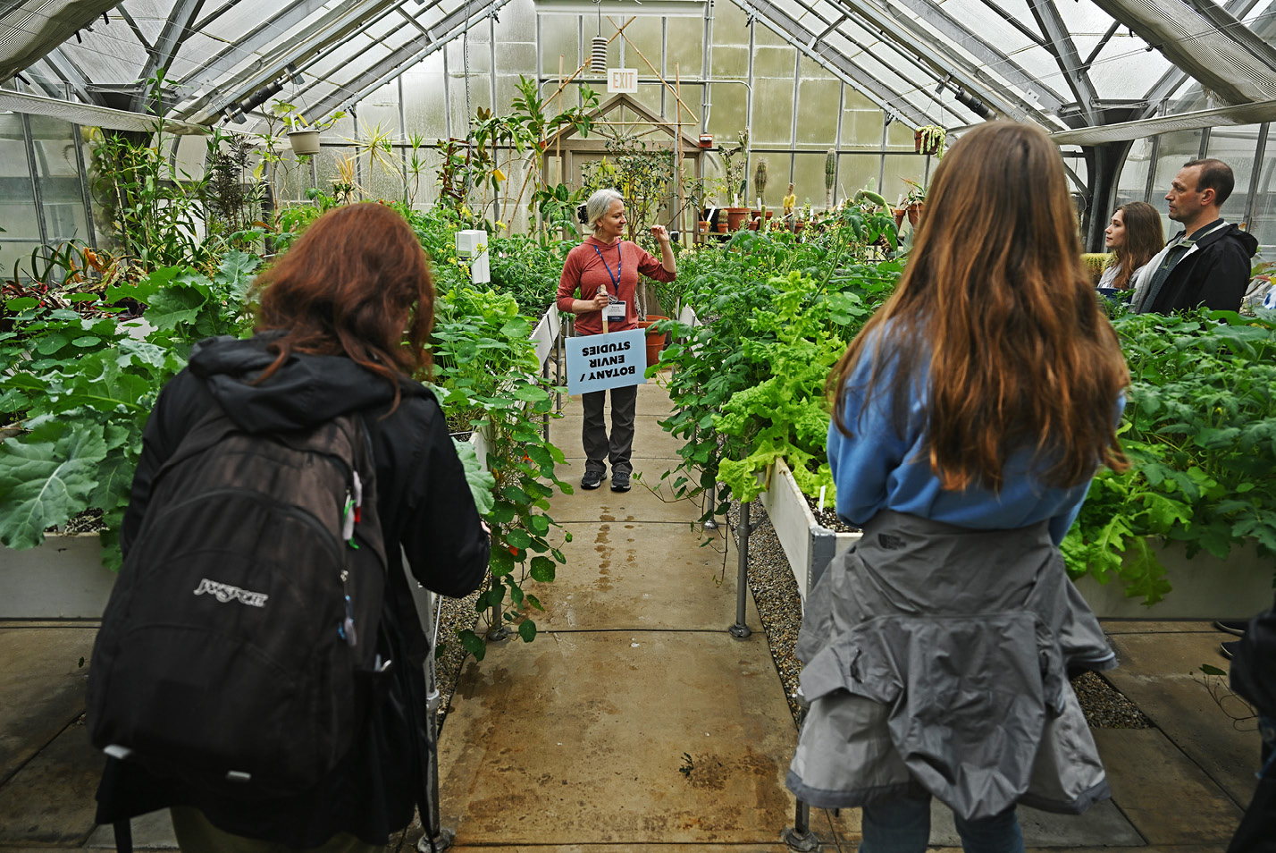 Prof. Rachel Spicer leads a tour through the greenhouse on Camel Days in April.