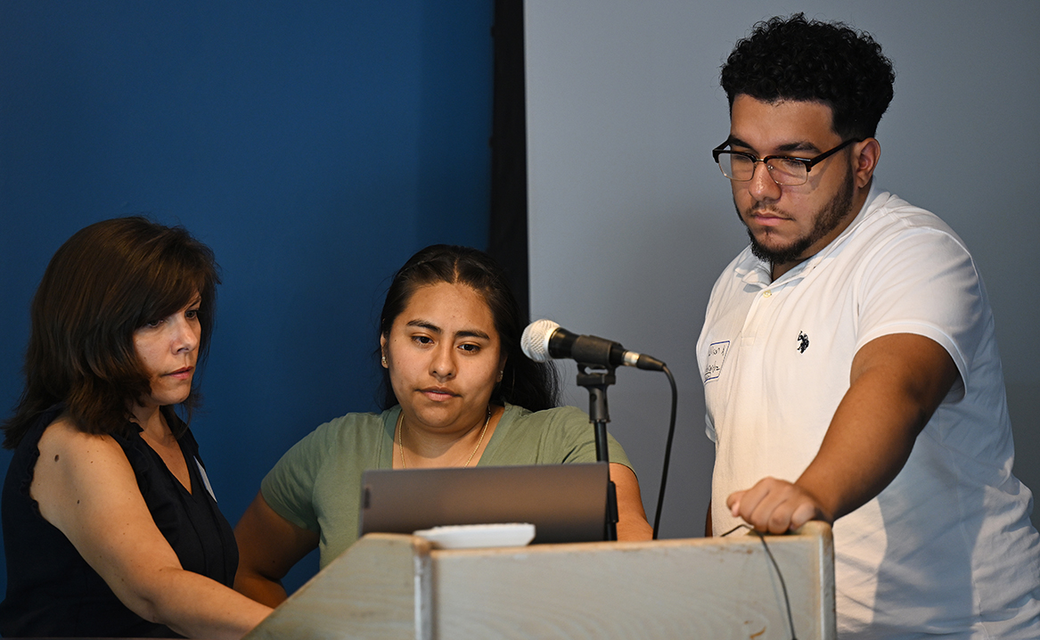 Rebecca McCue, Director of Community Engagement and Holleran Center Operations, left, meets with Summer Civic Leaders Bella Castellano Palacios ’25 and Wilson Hernandez ’26 before they make their final presentation Thursday, June 29, 2023 at Cro’s Nest.