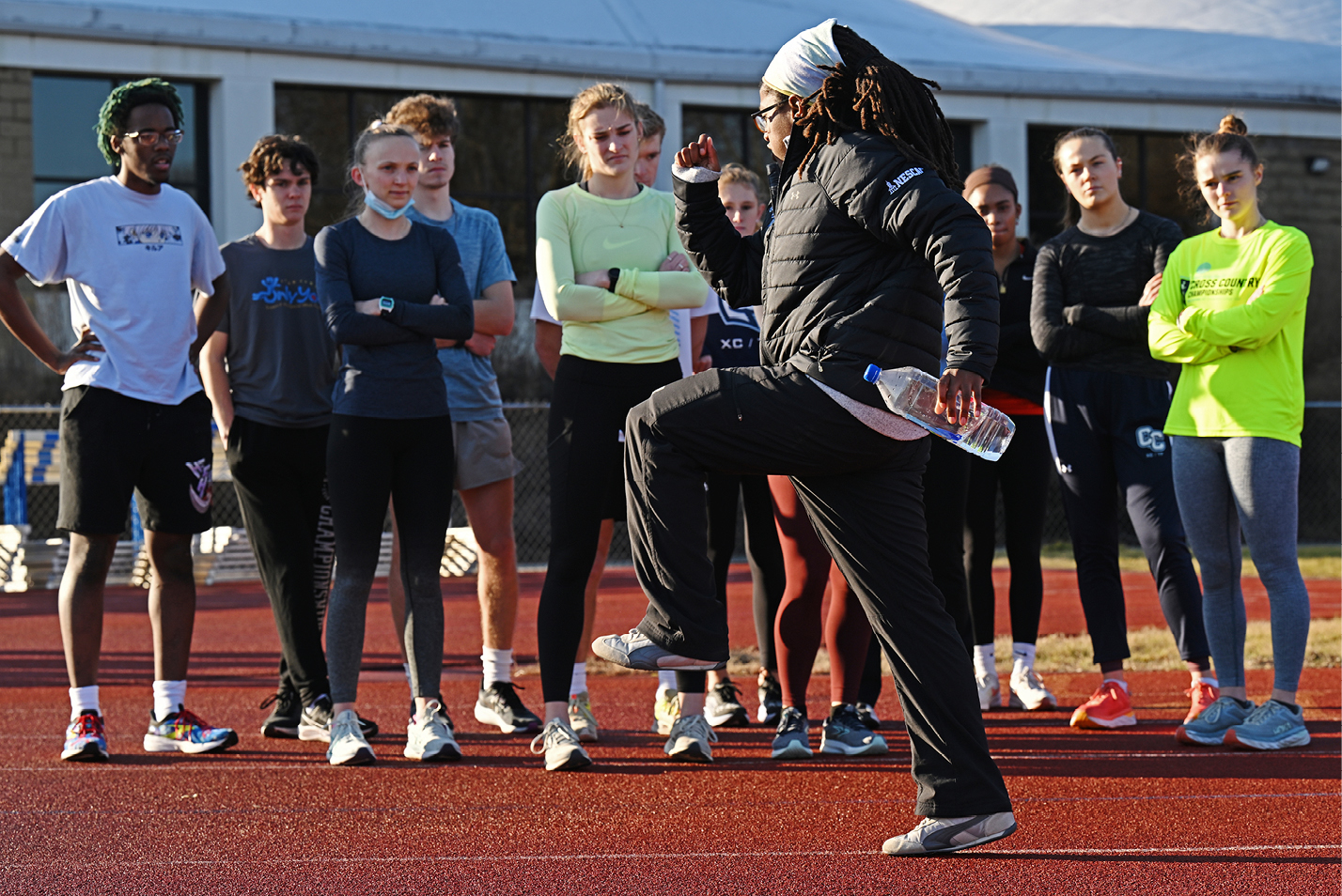 Symonne Scott, associate head coach of the Connecticut College men's and women's cross country and track & field programs, leads practice on Silfen Track.