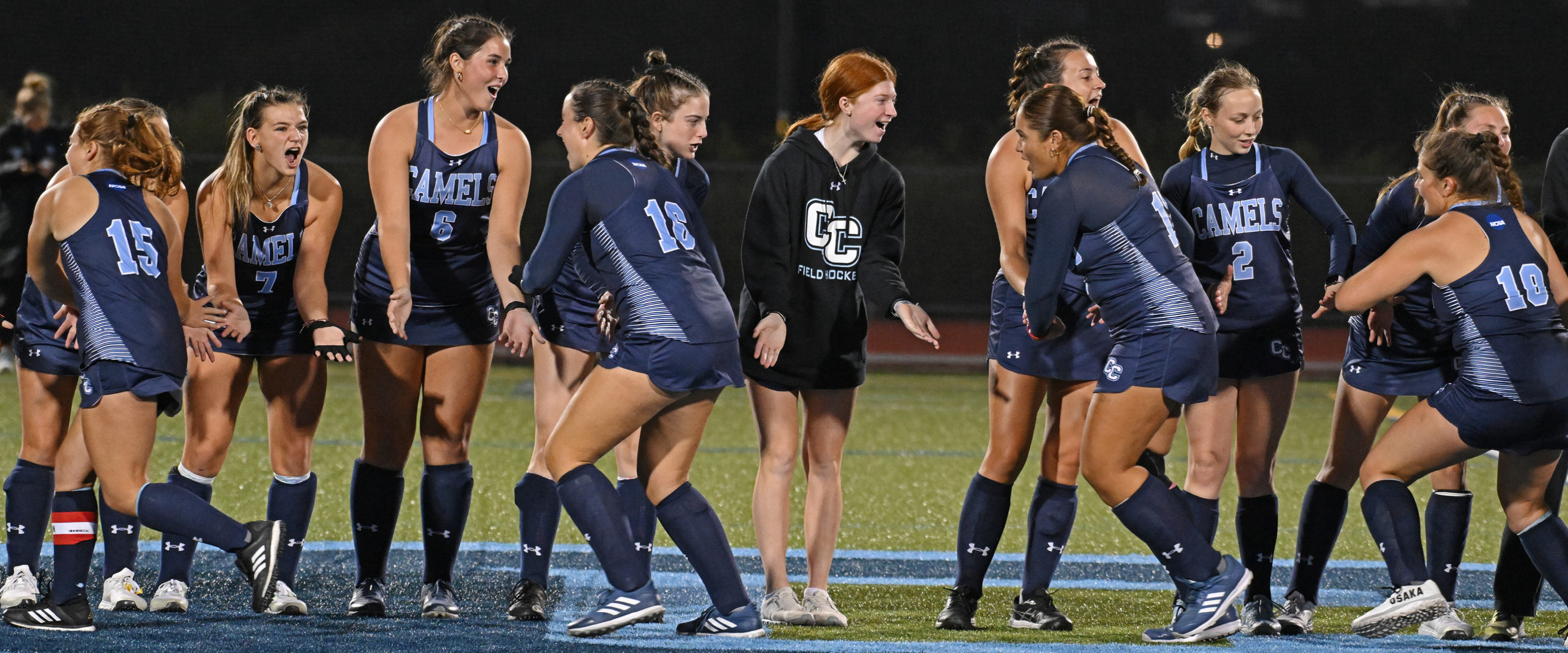 Field hockey team line up welcomes players to the field