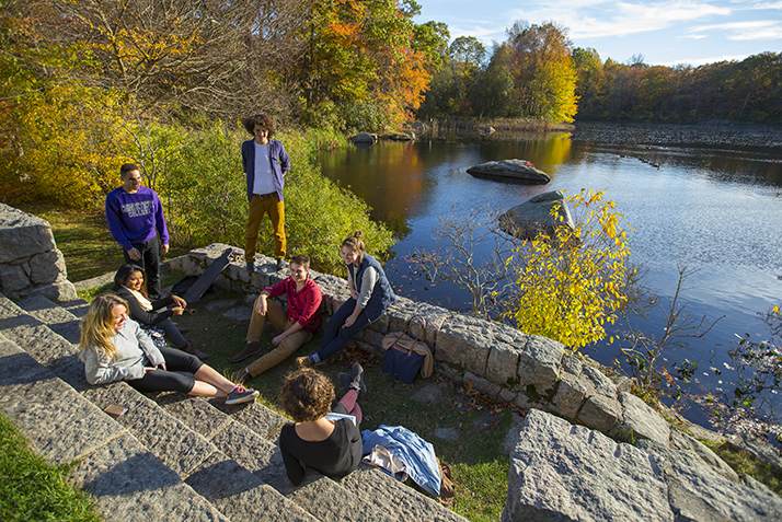 Students relax by the Arboretum pond