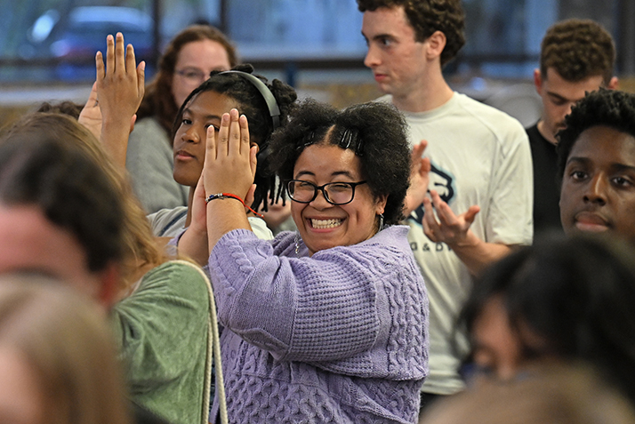 A student claps after a speech.