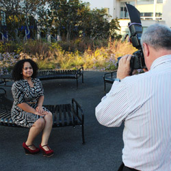 Jannette Rivera '14 gets a new LinkedIn picture taken by photographer Ken Abrahams ’82 at a recent reception for seniors. Photo by Miguel Salcedo '14.