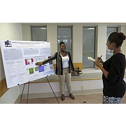 Amanda Crawford '14 presents her summer research at a recent poster session on campus. 
